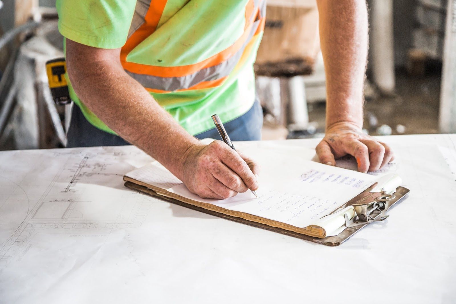 Here you can see a builder looking at his checklist for the commercial permitting process.